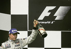 McLarens Formula One driver Kimi Raikkonen of Finland celebrates his victory at the Hungarian Grand Prix in Hungaroring, near Budapest, on Sunday