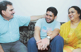 Abhishek with his family at his home in Mani Majra.