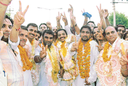 Elected ward representatives of the Mani Majra Vayopar Mandal in jubilant mood after their victory at Mani Majra on Monday.