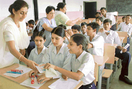 Members of the Inner Wheel Club of Chandigarh Midtown (district 308) distribute toothpastes and toothbrushes during a free dental check-up camp at Government High School, Sector 35, Chandigarh, on Monday. 