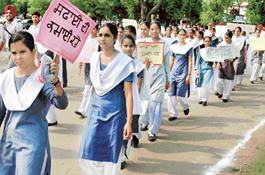 Schoolchildren take out a cleanliness awareness rally at Mohali on Monday. 