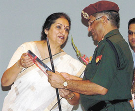 Meera Malhotra, Regional Head, ICICI Lombard General Insurance Company, hands over an insurance policy to Lt. Gen M.G. Girish, Director General, Discipline, Ceremonial & Welfare, Army Headquarters in the Capital on Monday.