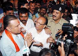 Dissident MLA Gordhan Jadafia, who refused a berth in Gujarat Chief Minister Narendra Modi's Cabinet, talks to mediapersons in Gandhinagar on Monday. 