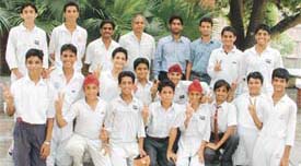 Kundan Vidya Mandir Senior Secondary School cricket team which won the Ludhiana zonal tournament with the school Principal, Mr S.C. Saxena