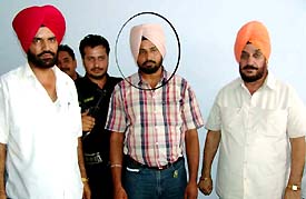 Reader to SDM Jasbir Singh in the custody of Vigilance Bureau following his arrest for graft in Moga on Monday