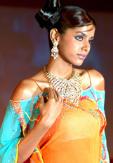 A model displays jewellery during a fashion show