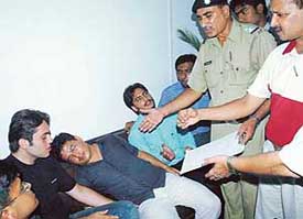 A police officer and a Panjab University teacher talk to a SOPU activist on relay fast on the campus on Wednesday. 