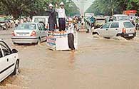 Traffic cops help clear a traffic jam at Press Chowk in Sector 18, Chandigarh. 