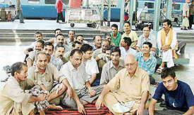 Railway vendors sit on dharna at the local railway station to press their demands. 