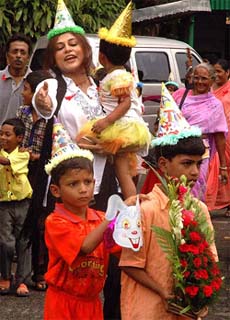 Film actress Rupa Ganguly plays with HIV positive children during a fun programme organised by CINI, a NGO, at Alipore Zoological Garden in Kolkata