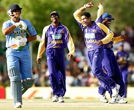 Sri Lankas Tillakaratne Dilshan (left) celebrates with Mahela Jayawardene after dismissing Suresh Raina during their tri-series one-day international against India at Dambulla on Wednesday. 