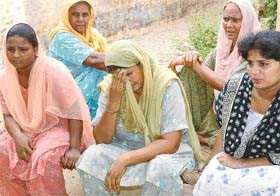 Krishna Devi breaks into tears as she relates the story of her son’s addiction at Roorhki Heeran village in Ropar district