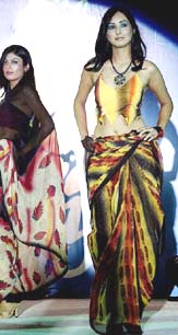 Models walk on the ramp during a fashion show in Lucknow on Thursday evening.