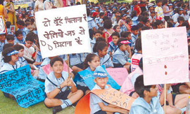 School Children participating in Polio Eradication Awareness Rally organised by Abhinandan Jan Kalyan Society and Delhi governments Directorate of Family Welfare at Yamuna Sports Complex in Vivek Vihar in the Capital on Friday.