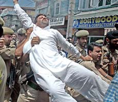 The police arrests supporters of the All-Party Hurriyat Conference, who were protesting against the Supreme Court order in the Parliament attack case, in Srinagar on Friday. 