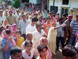 Residents protest against the killing of a housemaid at Pathankot on Friday.