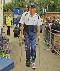 Australian bowler Glenn McGrath arrives on crutches to watch the second days play of the second Test at Edgbaston in Birmingham