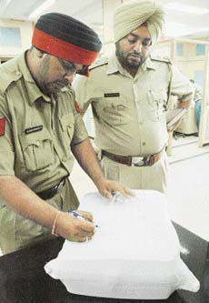 Cops seal the money seized from a bank locker of one of the persons arrested in connection with the rape of a minor, in Chandigarh
