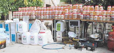 Spurious ghee tins lined up at the Kotwali police station in Ludhiana