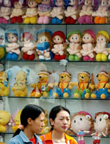 Girls walk past a shop displaying soft toys in Bangalore on Sunday. The Indian toy industry is estimated to be worth more than Rs 4.5 billion.