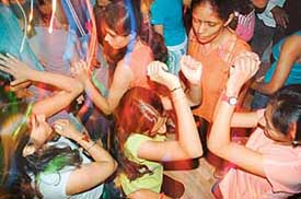 Party revellers dance to celebrate Friendship Day at Aerizzona, Sector 9, on Sunday. The event was sponsored by Sab Miller