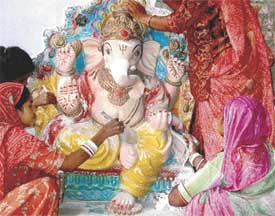 Artists from Jodhpur give final touches to the idols of Lord Ganesha in Chandigarh