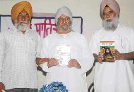 Punjabi writer Santokh Singh Dhir releases a book Hind de Soormey written by Gurbachan Singh Azad at a function organised by the Punjab Sahit Sabha in Dera Bassi on Sunday