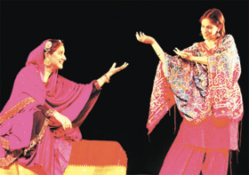 Sufi singer Zila Khan with another artist during a rehearsal of the play Gods, Graves and Grandmother