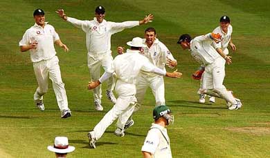 England players celebrate after beating Australia by two runs on the fourth day of the second Ashes Test at Edgbaston, Birmingham