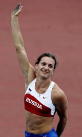 Yelena Isinbayeva of Russia waves to spectators after clearing a jump during the womens pole vault event at the World Athletics Championships in Helsinki on Sunday