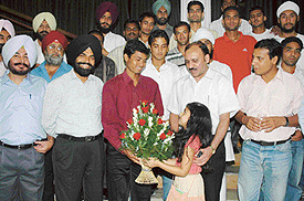 Members of the Indian hockey team being honoured by the Shaheed Umranangal Sports Trust at the Chandigarh Club in Chandigarh on Tuesday.