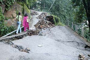 A Lower Kaithu road in Shimla that has been badly damaged by a heavy rain.