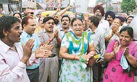Teachers of aided schools hold a protest near Arya Senior Secondary School, Ludhiana