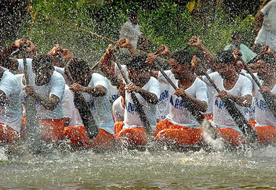 Indian oarsmen row their boat during a practice session for the upcoming Nehru boat race in Alleppy district in Kerala on Thursday