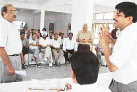 The Estate Officer, Mr S.P. Arora, listens to the grievances of people in an open darbar organised at a Community Centre in Sector-20, Panchkula