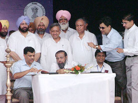 Punjab Principal Secretary S.C. Aggarwal, Managing Director of Guru Gobind Singh Refinery M.A. Tankewala, and HPCLs Director C. Ramalu sign the deed of assurance and re-launch in Phulokhari on Friday.