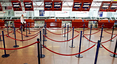 British Airways check-in desks are empty as flights are suspended due to a strike by the BA staff at the Heathrow airport in west London, on Friday