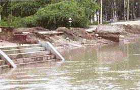 The caved-in portion of the road near Jandali Bridge near Ahmedgarh