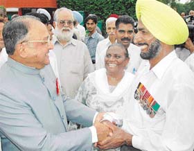 The Punjab Governor and UT Administrator, Gen S.F. Rodrigues (retd), greets a guest during At Home in Raj Bhavan in Chandigarh