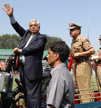 Jammu and Kashmir Chief Minister Mufti Mohd Sayeed, along with DGP Gopal Sharma, waves to the people during the Independence Day celebtrations at Bakshi Stadium in Srinagar on Monday. 