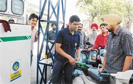 Panic-stricken residents at a petrol station in Ludhiana