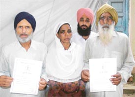 Parents of deceased Kala and Jassa who received bravery awards of their sons at the Independence Day function in Ludhiana on Monday