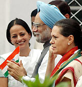 Prime Minister Manmohan Singh along with Congress President Sonia Gandhi at the 59th Independence Day celebrations at the AICC headquarters in New Delhi on Monday.