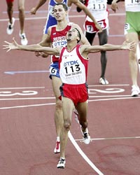 Bahrains Rashid Ramzi reacts after crossing the line ahead of Russias Yuriy Borzakovskiy to win the gold medal in the mens 800 metres final at the World Athletics Championships in Helsinki on Sunday