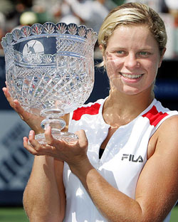 Belgiums Kim Clijsters holds up the trophy after defeating Slovakias Daniela Hantuchova in the final of the Los Angeles Open in Carson, California