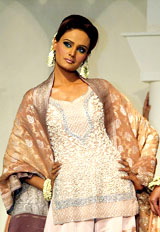 A Pakistani model displays a creation of designer Hassan Sheheryar Yasin in Lahore on Tuesday