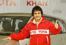 Bollywood actor Aamir Khan poses for photographers in Mumbai on Wednesday. Toyota Kirloskar Motors signed the leading Bollywood actor as a brand ambassador to promote its utility vehicle Innova in India. 