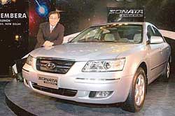 Hyundai Motors (India) Managing Director S.S. Yang with the companys newly launched car, Sonata Embera, in New Delhi 