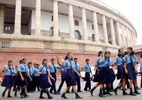 Excited schoolchildren emerge from Parliament after a visit inside to view the days proceedings