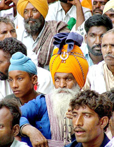 Employees of the Food Corporation of India, under the banner of the All-India FCI Mazdoor Federation, protest against the policies of the Centre at Parliament Street in New Delhi on Wednesday. 